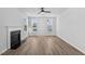 Bright living room features a fireplace, hardwood floors, recessed lights and lots of natural light at 2820 Lacy Holt Rd, Graham, NC 27253