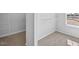 Bright walk-in closet offers ample storage space with shelving and carpeted flooring at 2820 Lacy Holt Rd, Graham, NC 27253