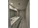 Spacious bathroom with double vanity, quartz countertop, and marble flooring at 1341 Bessie Ct, Wake Forest, NC 27587
