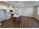 Bright kitchen features white cabinets, stainless steel appliances, and an island with white countertop and pendant lighting at 1341 Bessie Ct, Wake Forest, NC 27587