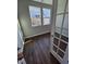A sun-drenched office with hardwood flooring, two windows, and a glass-paneled door at 1341 Bessie Ct, Wake Forest, NC 27587