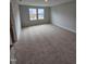 Spacious bedroom with neutral walls, plush carpet, and natural light at 1345 Bessie Ct, Wake Forest, NC 27587