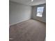 Well-lit bedroom with neutral walls, plush carpet and a bright window at 1345 Bessie Ct, Wake Forest, NC 27587