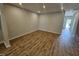 Spacious living room featuring hardwood floors and recessed lighting at 1345 Bessie Ct, Wake Forest, NC 27587