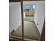 View of patio and fenced backyard through sliding glass door at 1345 Bessie Ct, Wake Forest, NC 27587