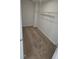 Walk-in closet featuring plush carpeting and white wire shelving for optimal organization and storage at 1349 Bessie Ct, Wake Forest, NC 27587