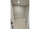 A practical laundry room with tile floors, a utility sink base, and wire shelving at 1349 Bessie Ct, Wake Forest, NC 27587