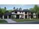 Modern luxury home featuring a three car garage with a concrete driveway at 4908 Foxridge Dr, Raleigh, NC 27614