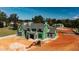 View of new construction home with gray shake roof, green exterior wrap and heavy equipment on unfinished lawn at 705 Parker Creek Dr, Raleigh, NC 27614