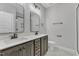 Modern bathroom with double vanity and a large mirror at 119 Water Ave, Wake Forest, NC 27587