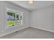 Bright bedroom with large window and neutral decor at 119 Water Ave, Wake Forest, NC 27587