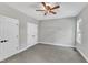 Bedroom with double doors and neutral color palette at 119 Water Ave, Wake Forest, NC 27587