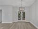 Bright dining room with French doors leading to deck at 119 Water Ave, Wake Forest, NC 27587