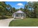Charming one-story house with a covered front porch, and beautiful landscaping at 119 Water Ave, Wake Forest, NC 27587
