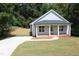 Front view of charming craftsman home and driveway at 119 Water Ave, Wake Forest, NC 27587