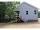 Rear view of house showcasing deck and stairs at 119 Water Ave, Wake Forest, NC 27587