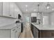 Well-equipped kitchen with granite countertops, stainless appliances, and spacious center island with seating at 119 Water Ave, Wake Forest, NC 27587
