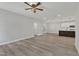 Open living space with hardwood floors and ceiling fan at 119 Water Ave, Wake Forest, NC 27587