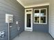 View of the back porch with a door and a window at 484 Traditions Grande Blvd # 29, Wake Forest, NC 27587