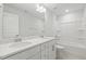 Bathroom featuring double sinks, granite countertops, a mirror and a shower tub combo at 484 Traditions Grande Blvd # 29, Wake Forest, NC 27587