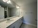 Bathroom featuring double sink vanity with granite countertop and tiled floor at 484 Traditions Grande Blvd # 29, Wake Forest, NC 27587