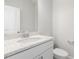 Elegant bathroom with a white vanity, granite countertop and a framed mirror at 484 Traditions Grande Blvd # 29, Wake Forest, NC 27587