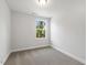 Clean and bright bedroom with carpet and a single window at 484 Traditions Grande Blvd # 29, Wake Forest, NC 27587