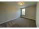 Bright bedroom features neutral paint, plush carpet and natural light from the window at 484 Traditions Grande Blvd # 29, Wake Forest, NC 27587