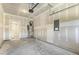 Spacious unfinished garage with water heater and bare concrete floor at 484 Traditions Grande Blvd # 29, Wake Forest, NC 27587