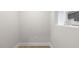 Neutral hallway leading to a room with a modern kitchen featuring gray cabinets at 484 Traditions Grande Blvd # 29, Wake Forest, NC 27587