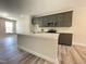 Modern kitchen with a spacious island, gray cabinetry, and stainless steel appliances, offering a sleek design at 484 Traditions Grande Blvd # 29, Wake Forest, NC 27587