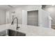 Kitchen island with a deep sink, granite countertop, and pantry door, with access to the upper level at 484 Traditions Grande Blvd # 29, Wake Forest, NC 27587