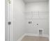 Laundry room with tile flooring and wire shelving at 484 Traditions Grande Blvd # 29, Wake Forest, NC 27587