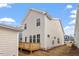 View of the back of the home and wooden deck overlooking a spacious backyard at 9237 Kitchin Farms Way # 429, Wake Forest, NC 27587