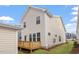 View of the rear exterior of the home featuring a wood deck and modern siding at 9237 Kitchin Farms Way # 429, Wake Forest, NC 27587