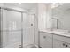 Bright bathroom with a glass shower and a double sink vanity with white cabinets at 9237 Kitchin Farms Way # 429, Wake Forest, NC 27587