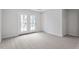 The primary bedroom features double doors leading to a balcony at 9237 Kitchin Farms Way # 429, Wake Forest, NC 27587