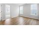 Bright bedroom features laminate floors and three windows providing plenty of natural light at 9237 Kitchin Farms Way # 429, Wake Forest, NC 27587