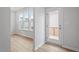 Bright entryway with wood-look floors and access to an outdoor deck or patio at 9237 Kitchin Farms Way # 429, Wake Forest, NC 27587