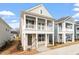 Charming two-story home featuring a welcoming front porch and classic architectural details at 9237 Kitchin Farms Way # 429, Wake Forest, NC 27587