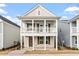 Inviting two-story home showcasing a covered front porch, perfect for relaxing outdoors at 9237 Kitchin Farms Way # 429, Wake Forest, NC 27587