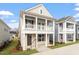 Charming two-story home featuring a welcoming double porch and neutral siding at 9237 Kitchin Farms Way # 429, Wake Forest, NC 27587