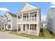Charming two-story home featuring a welcoming double porch and neutral siding at 9237 Kitchin Farms Way # 429, Wake Forest, NC 27587