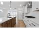 Kitchen boasts an island, stainless steel appliances, and a stylish white and wood design at 9237 Kitchin Farms Way # 429, Wake Forest, NC 27587