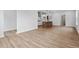 Open concept living and kitchen area with wood-look flooring and modern appliances at 9237 Kitchin Farms Way # 429, Wake Forest, NC 27587