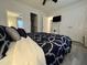 Well-lit bedroom with stylish bedding, mirrored closet doors, and a ceiling fan at 129 Sturbridge Dr # 15, Clayton, NC 27520