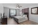 Bright bedroom with hardwood floors, ceiling fan, desk, and closet at 129 Sturbridge Dr # 15, Clayton, NC 27520