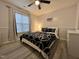 Cozy bedroom features a ceiling fan and window with natural light at 129 Sturbridge Dr # 15, Clayton, NC 27520