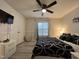 Relaxing bedroom features a ceiling fan, closet, and dresser for ample storage at 129 Sturbridge Dr # 15, Clayton, NC 27520
