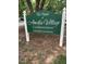Community sign reads: The Pointe at Amelia Village, Condominiums, A Private Community at 129 Sturbridge Dr # 15, Clayton, NC 27520